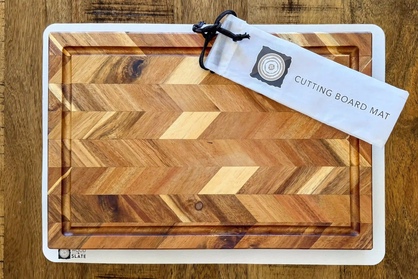 Wooden cutting board with a pattern and a tag on a wooden surface