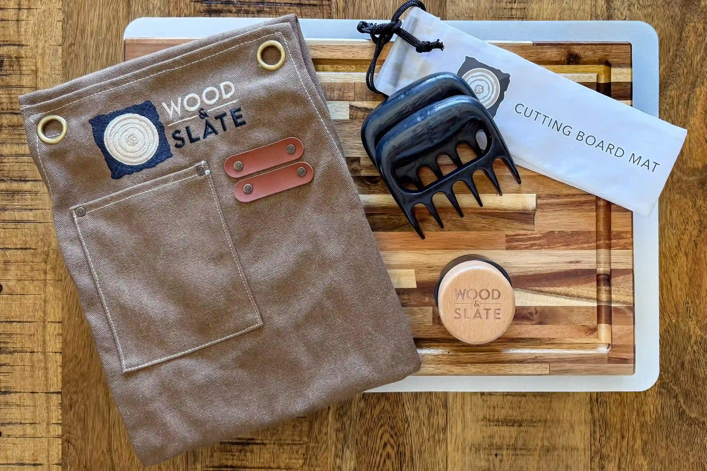 Brown leather pouch, wooden cutting board, and tools on a wooden surface with 'Wood & Slate' branding.